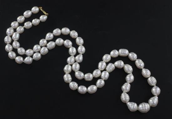 A modern single strand baroque pearl necklace with 18ct gold clasp, 83cm.
